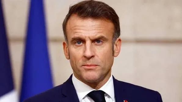 Macron warns Iran against imposing tolls on Strait of Hormuz as deal details emerge